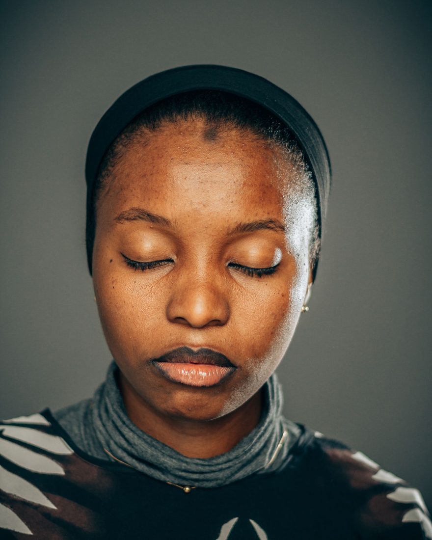 A Black woman resting with her eyes closed, at peace &mdash; a moment of being fully understood